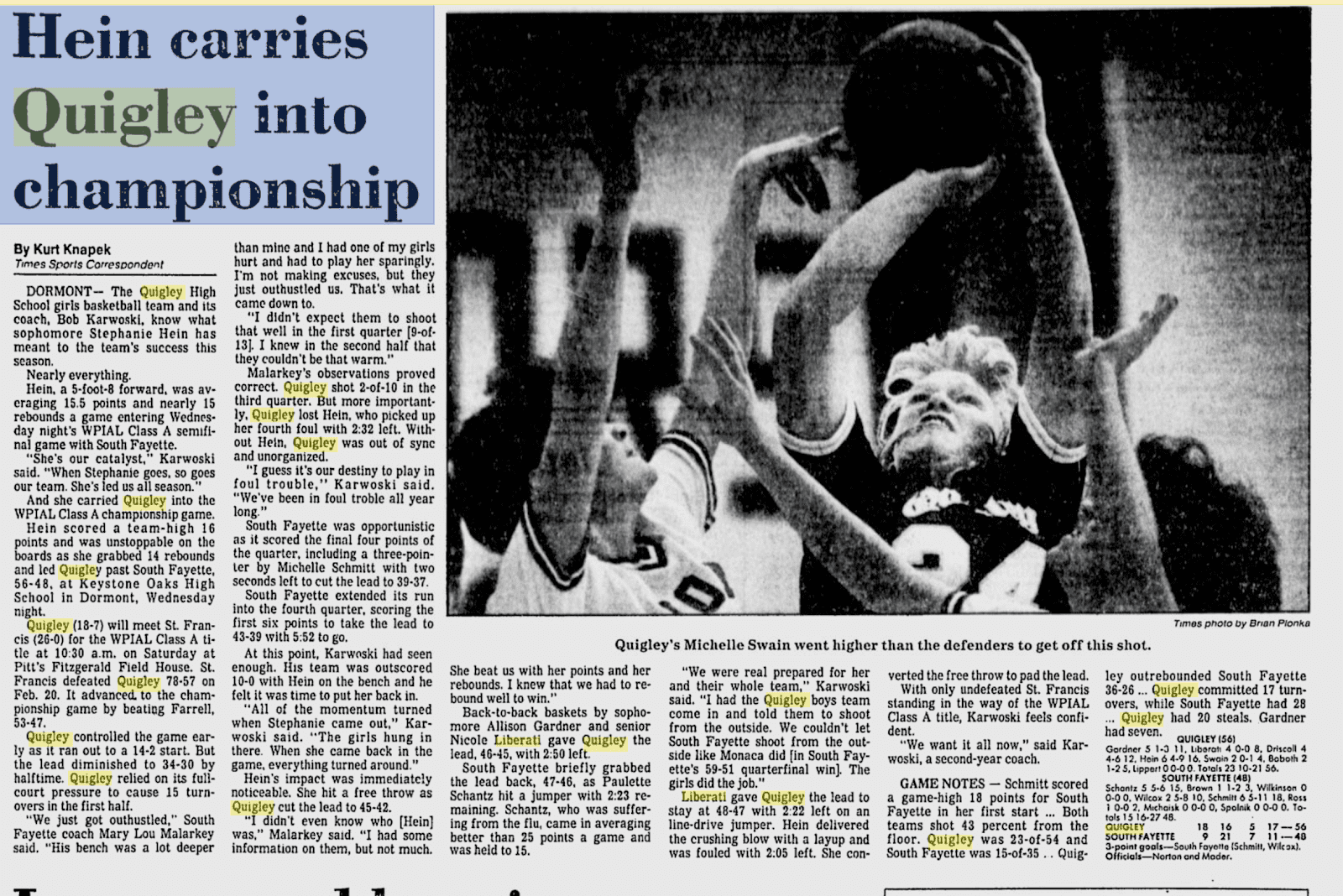 Basketball players compete intensely during a game, with one attempting a shot.