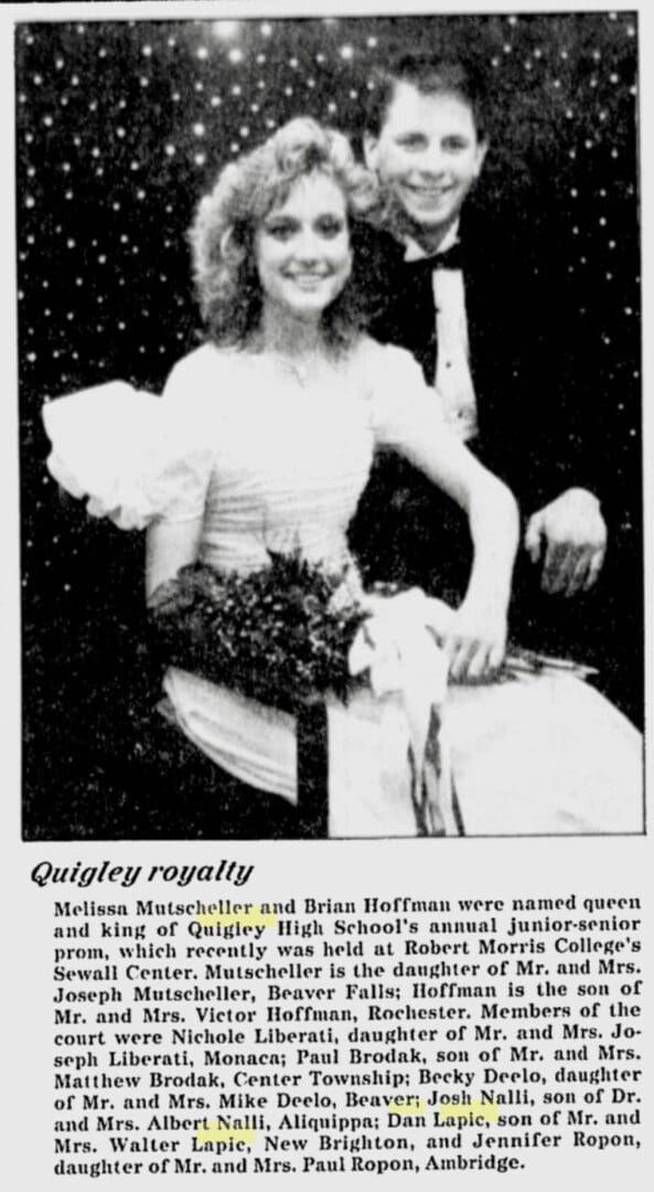 Prom couple smiling in formal attire.